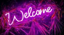 Pink neon welcome sign